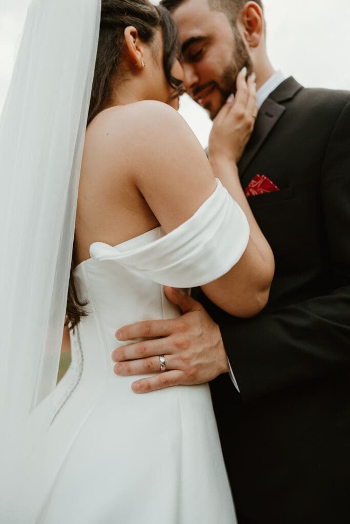 Bride and groom share intimate moment after their Wedding Ceremony. 