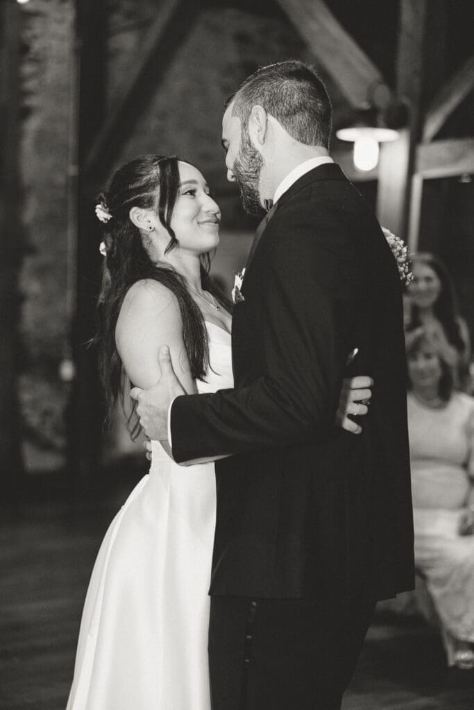 Bride and groom share first dance in the barn at Tyler Arboretum in Media PA. 