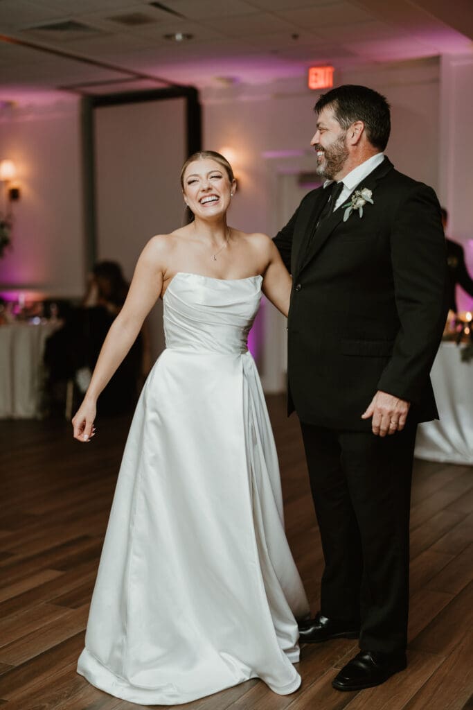 Bride and father share father daughter dance in Brookside country club ballroom
