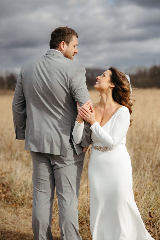 Tall groom and short bride pose for wedding portraits in Berks County PA. 