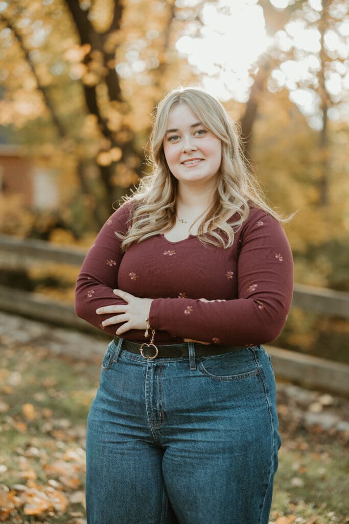 Senior girl posing in soft golden light for her senior portraits in Lehigh Valley. 