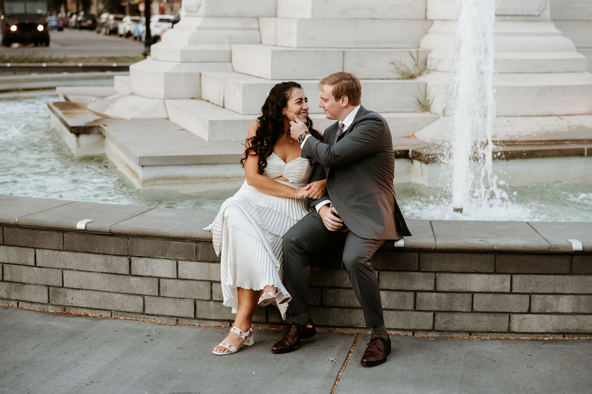 Engagement session at the fountains in downtown Easton with couple kissing.